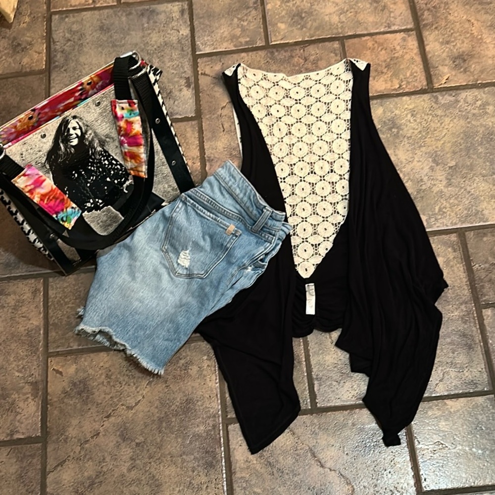 Black vest with lace style panel